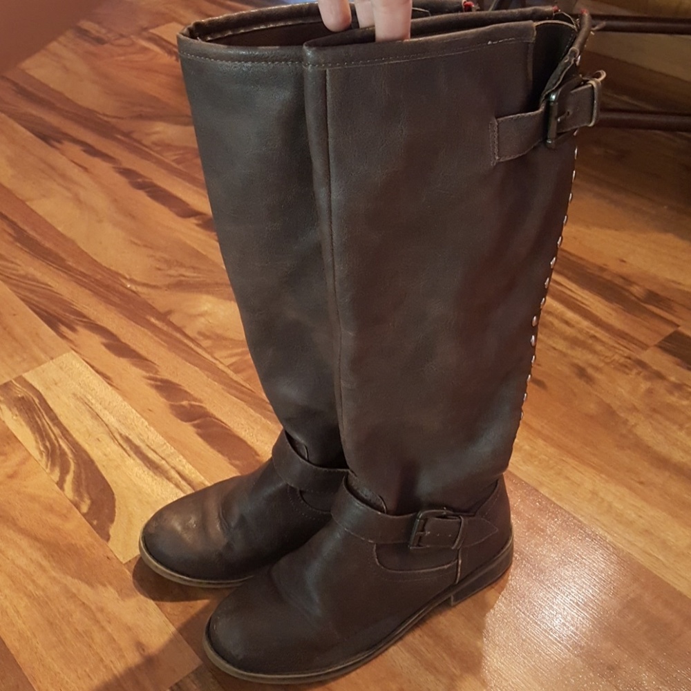 Tall brown boot with zip detail in back